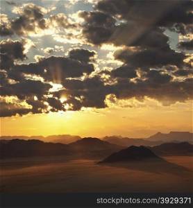 Dramatic African sunrise over the Namib-Naukluft Desert near Sossusvlei in Namibia