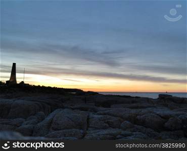 Dramatic beatiful sunset with clouds over the Baltic sea Europe. Beautiful seascape rock coast