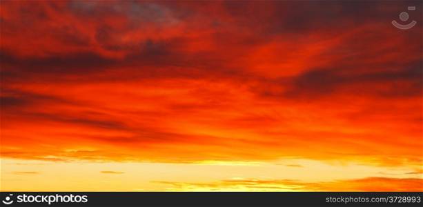 dramatic bright red yellow sunrise clousdscape