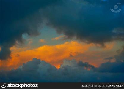 Dramatic clouds at sunset sky orange clouds