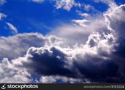 dramatic clouds in the blue sky