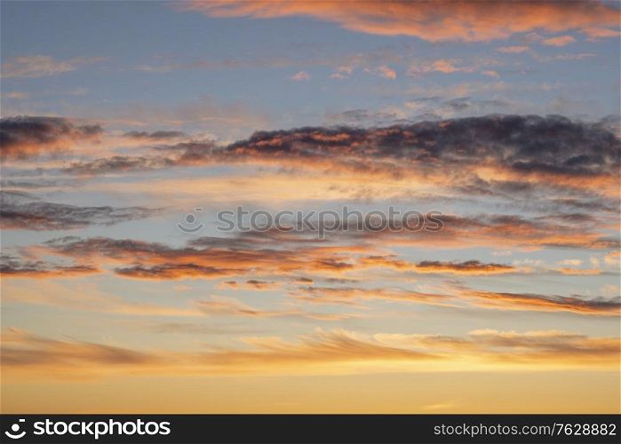Dramatic clouds in the sunset on a blue sky in the summertime