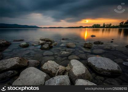 Dramatic clouds on the shore of Lake Constance at sunset