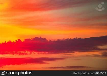 Dramatic colorful cloudy sky with picturesque clouds lit by sunset