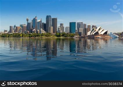 Dramatic panoramic photo Sydney harbor. Dramatic widescreen panoramic image of the city of Sydney from Taronga Zoo with artificial water in the harbour. Dramatic panoramic photo Sydney harbor
