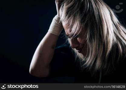 Dramatic portrait of a woman with mood problems - depression disorder concept. Female Mental Health Patient with Depressive Disorder