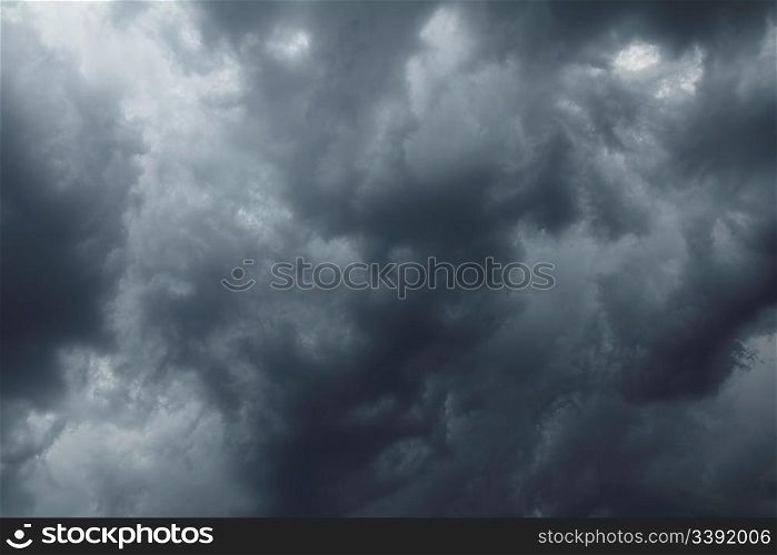 dramatic scene with storm clouds on moody sky