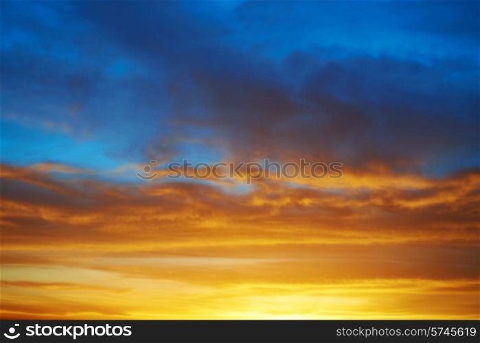 Dramatic sky at sunset with red, yellow, orange and blue colors