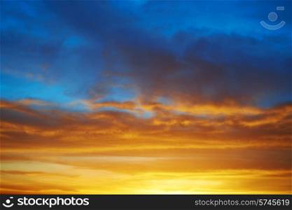 Dramatic sky at sunset with red, yellow, orange and blue colors