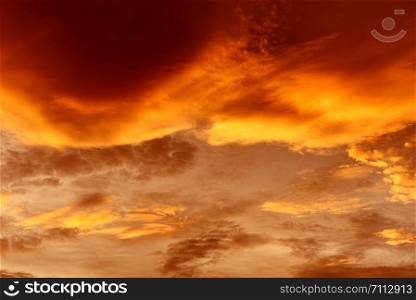 Dramatic sky sunset or sunrise colorful red and orange sky over and cloud beautiful multicolor fiery background