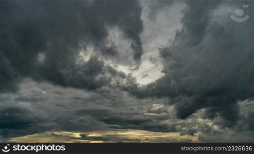 Dramatic storm clouds at dark sky
