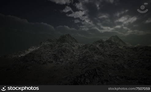 dramatic storm sky with the sun coming through the dark clouds over rough mountains in Iceland. Dramatic Storm Sky over Rough Mountains