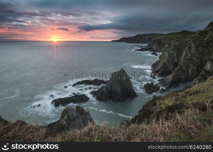 Dramatic sunrise landscape over Bull Point in Devon England