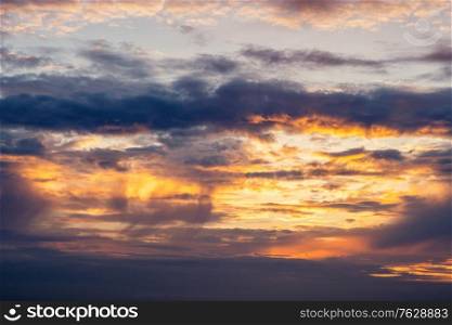 Dramatic sunset in orange and violet colors on a summer evening