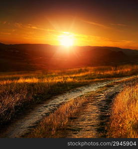 Dramatic sunset over autumnal valley, natural landscape