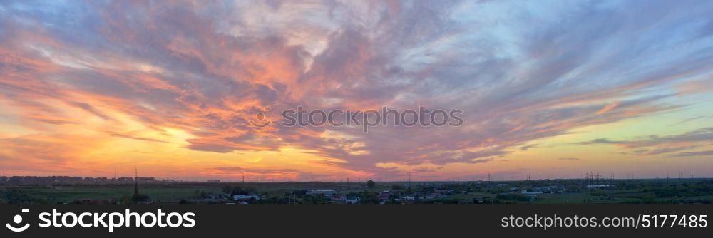 Dramatic sunset over city in spring time