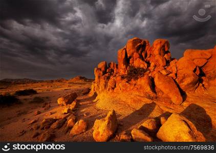 Dramatic sunset scene in Gobi stone desert, Mongolia