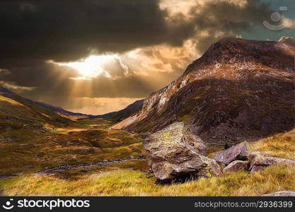 Dramatic sunset with beautiful sky over mountain range giving a strong moody landscape