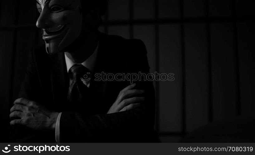 Dramtic dolly shot of Anonymous hacker in prison (B/W Version)