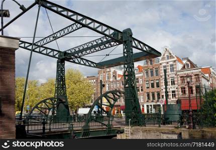Drawbridge and historic row houses in Amsterdam, Netherlands.