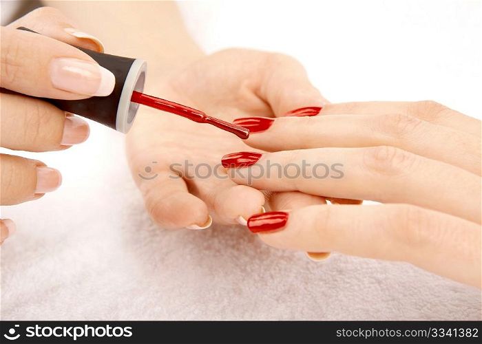 Drawing of a red varnish on the nails, isolated on a white background