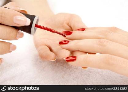 Drawing of a red varnish on the nails, isolated on a white background