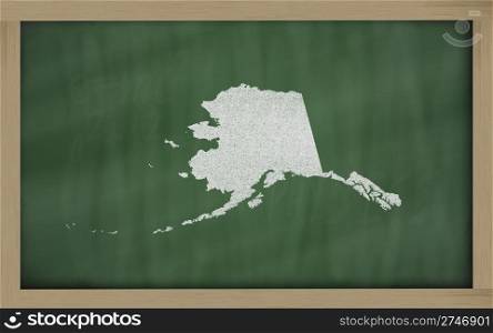 drawing of alaska state on chalkboard, drawn by chalk