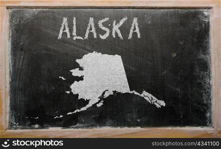 drawing of american state of alaska on chalkboard, drawn by chalk
