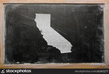 drawing of american state of california on chalkboard, drawn by chalk