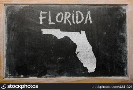drawing of american state of florida on chalkboard, drawn by chalk
