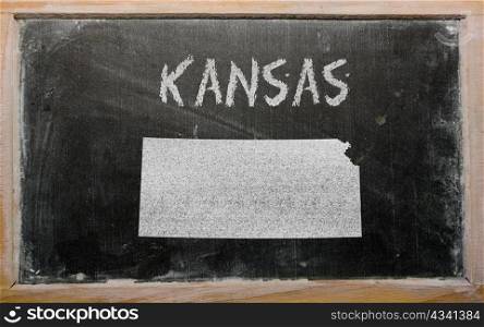 drawing of american state of kansas on chalkboard, drawn by chalk