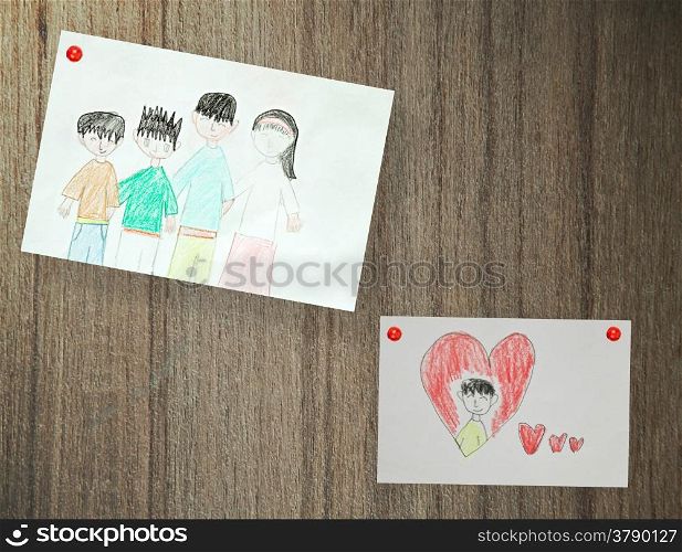 Drawing of family, paper on wood background
