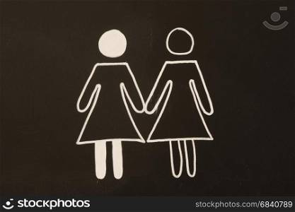 drawing of two woman together on a blackboard