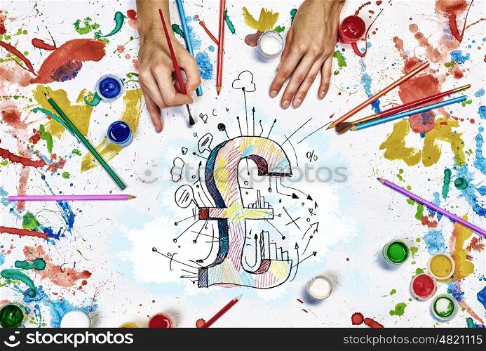 Drawing pound concept. Top view of hands drawing pound currency concept