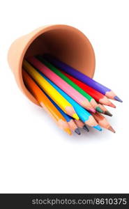 Drawing supplies: assorted color pencils in ceramic pot, isolated on white background
 . Color pencils