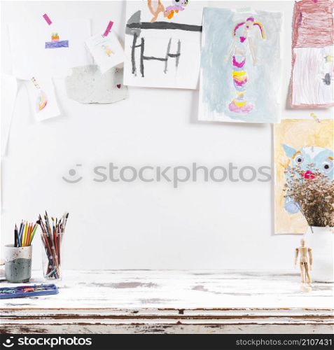 drawing table with children paintings
