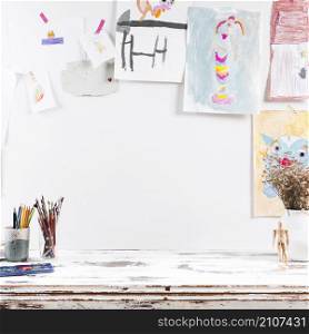 drawing table with children paintings