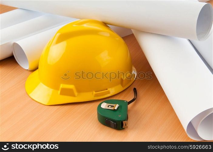 Drawings and hard hat on the desk