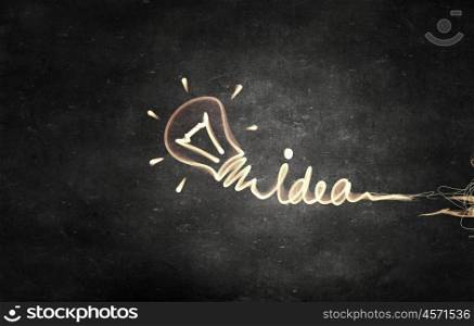 Drawn bulb on wall. Conceptual background image with light bulb as idea symbol