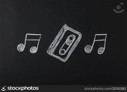 drawn musical notes with cassette tape blackboard
