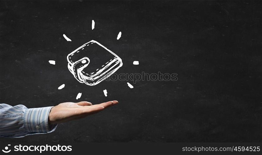 Drawn wallet. Person hand holding chalk drawn wallet on blackboard background
