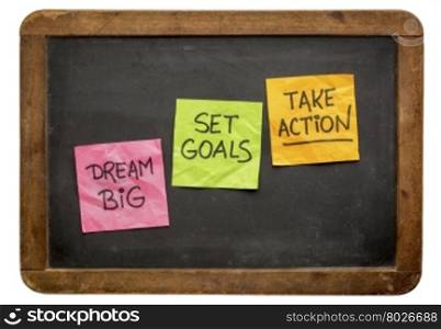 dream big, set goals, take action - motivational advice or reminder on sticky notes against isolated vintage blackboard