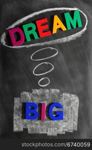 Dream big - text made of colorful letters and drawn on a blackboard
