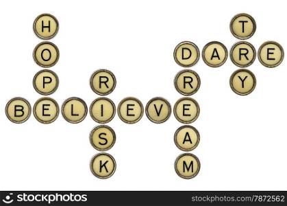 dream, hope, believe, risk, dare, try - motivational crossword in old round typewriter keys isolated on white
