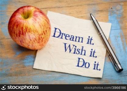 Dream it, Wish it, Do it, Handwriting on a napkin with a fresh apple,