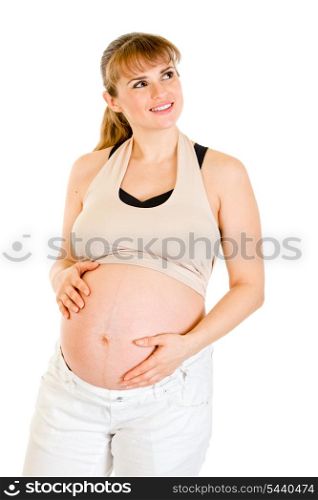 Dreaming beautiful pregnant woman touching her belly isolated on white background&#xA;
