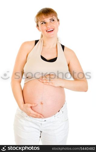 Dreaming beautiful pregnant woman touching her tummy isolated on white background&#xA;