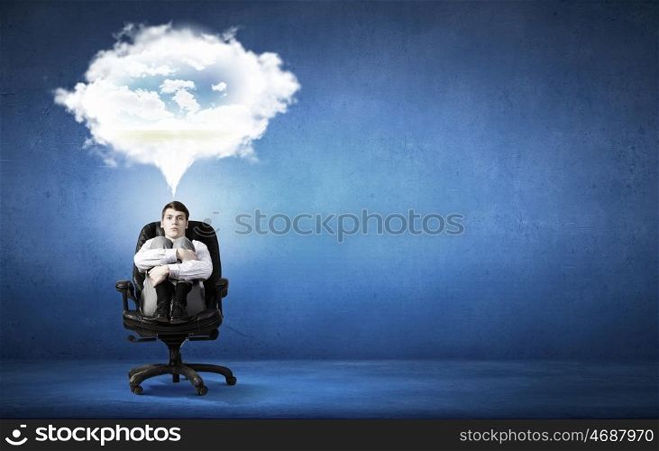 Dreaming businessman. Confident handsome businessman sitting in chair and dreaming