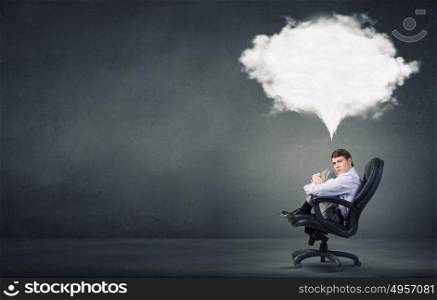 Dreaming businessman. Confident handsome businessman sitting in chair and dreaming