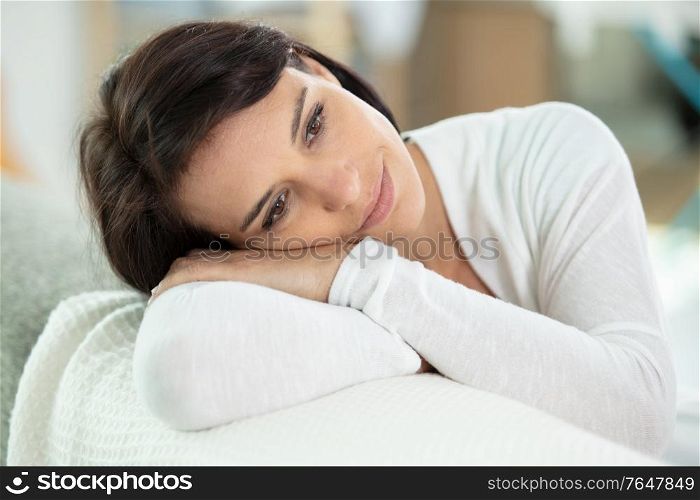 dreamy woman on the sofa relaxing
